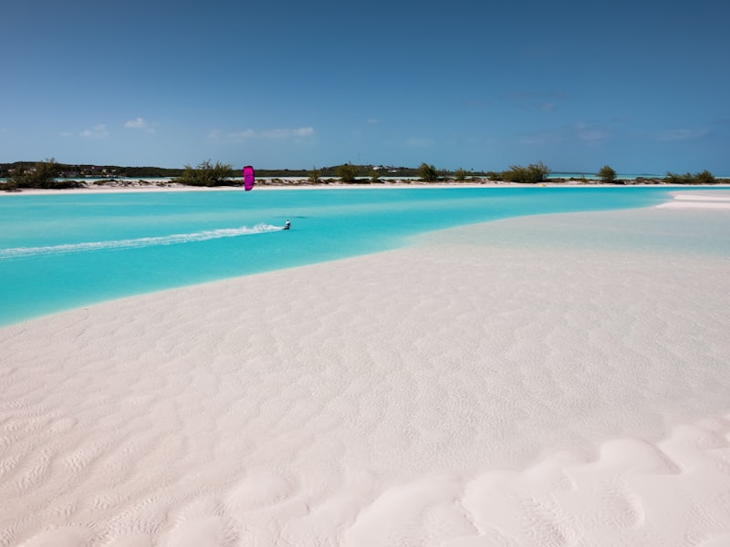 A turquoise lagoon with a white sandbar