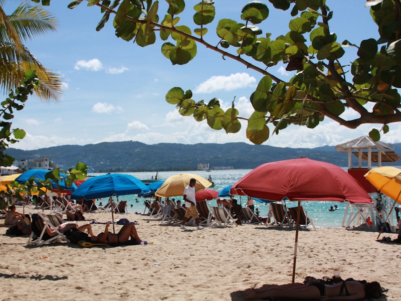Umbrellas and swimmers on a Montego Bay beach